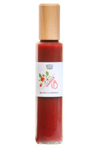 Balsamico mit Himbeermark in einer Glasflasche